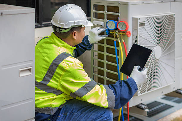 Professional Heat Pump Repair technician working in Old Bethpage, NY